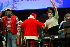 Santa and Hope dancing at Christmas in the Kitchen